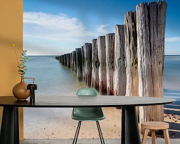 wooden breakwater on the beach along the Dutch coast near Burgh-Haamstede by gaps photography