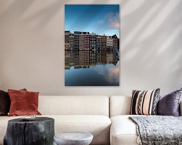 canal houses on the Damrak in Amsterdam, the capital of the Netherlands. by gaps photography