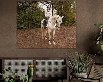 Training with the white horse on a riding arena in autumn by Babetts Bildergalerie