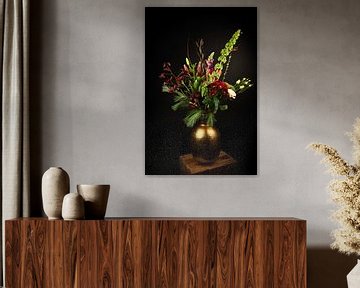 Bouquet of red flowers in a golden vase