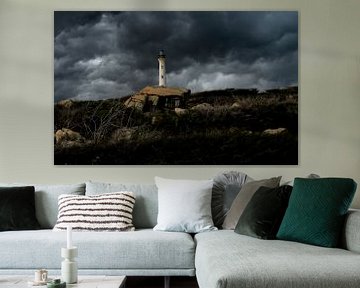 Thunderclouds around the lighthouse of Aruba by Ronald Huijben