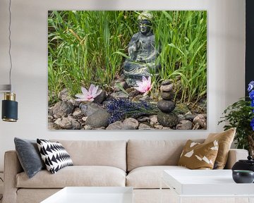 Buddha sitting in the grass in a Japanese garden by Animaflora PicsStock