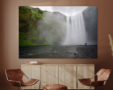 Iceland - Skogafoss waterfall with person arms stretched wide by adventure-photos