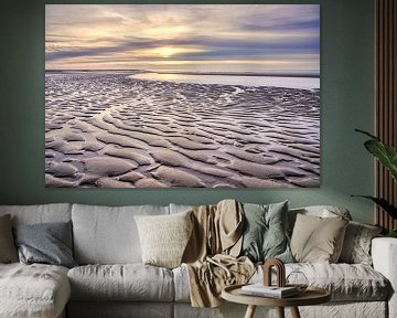 strand met de Noordzee bij een zonsondergang van eric van der eijk