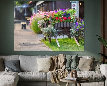 Old wooden cart rebuilt as a flower bed. by Yevgen Belich