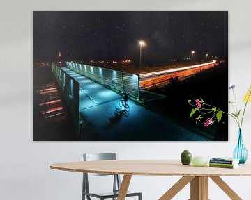 Cyclist on a highway bridge - long exposure night photography by Chihong