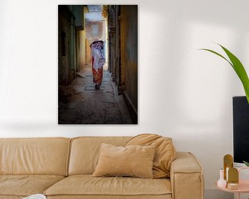 Indian woman in one of the alleys of the city Varanasi Benares in India. Wout Kok One2expose by Wout Kok