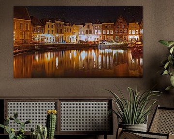 The harbour of Goes in nocturnal light with clear starry skies by Gert van Santen