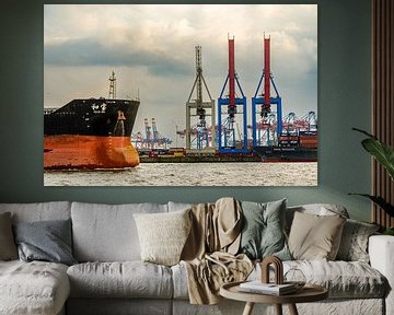 Bow cargo ship and loading cranes in port of Hamburg with Elbe river by Dieter Walther