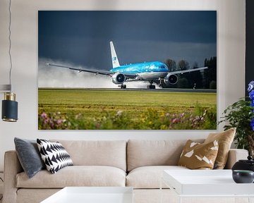 Dark clouds, soaking wet runway and sunshine! Beautiful conditions to see this KLM Boeing 777 take o by Jaap van den Berg