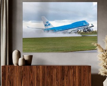 A KLM Boeing 747-400 takes off from a wet Polderbaan. by Jaap van den Berg