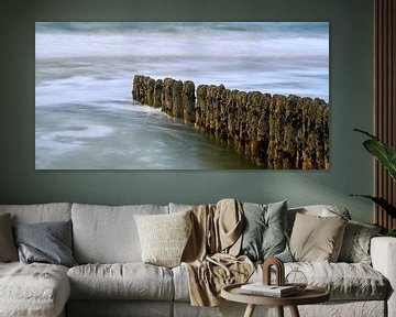 Wooden buoy in the surf by Bodo Balzer