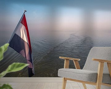 Dutch flag with water and foggy weather in the background by Jolanda Aalbers