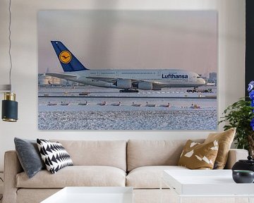 A Lufthansa Airbus A380 is towed to a hangar. by Jaap van den Berg
