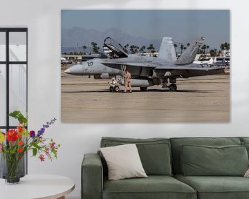 A pilot of a VMFAT 101 F/A-18C Hornet prepares to depart from Long Beach Airport, California. by Jaap van den Berg