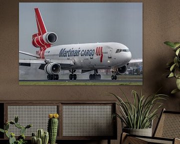 A McDonnell Douglas MD-11 of Martinair Cargo (PH-MCR) has just landed on a wet Polderbaan! by Jaap van den Berg