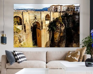 Puente arabe en oud stadsgebouw van Ronda bij de kloof Tajo de Ronda Andalusië Spanje van Dieter Walther