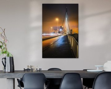 The Erasmus Bridge in Rotterdam Holland with traffic in the evening by Bart Ros