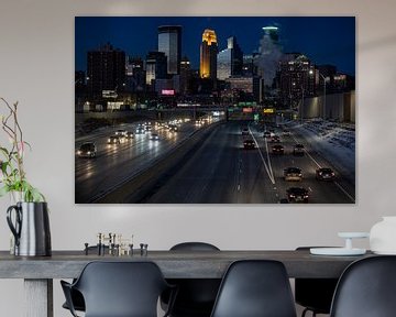 Minneapolis Skyline in the evening, seen from the bridge with the highway and car lights by Eric van Nieuwland
