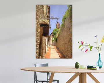 A picturesque street scene in Assisi by Berthold Werner