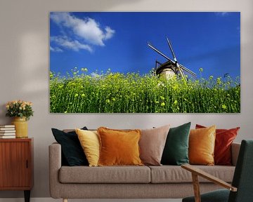 Windmill against blue sky by Wijnand Kroes