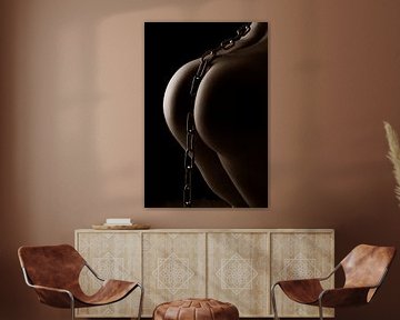 nude female butt with steel chain by Jörg B. Schubert