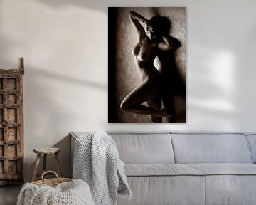female nude posing on a wall by Jörg B. Schubert