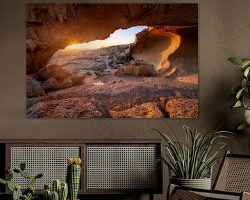 Sunrise under a stone arch