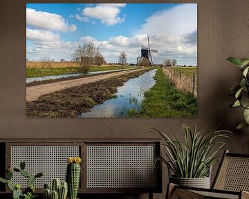 Nederlands landschap met een poldermolen van Ruud Morijn