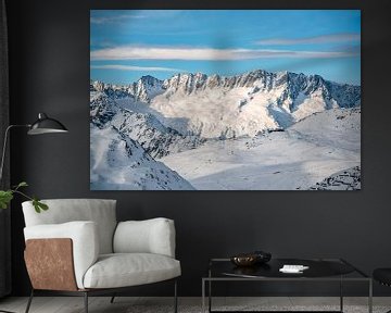 View over the Andermatt ski resort to the Swiss mountains by Leo Schindzielorz