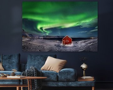 Red wooden house with aurora borealis on Lofoten Islands in Norway. by Voss Fine Art Fotografie