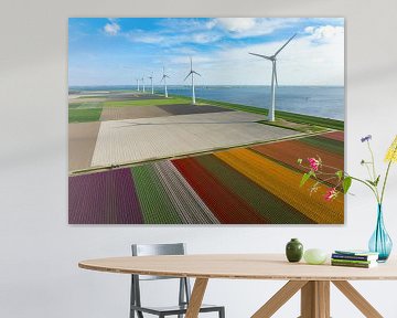 Tulips in agricutlural fields during springtime with wind turbines by Sjoerd van der Wal