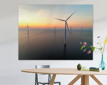 Wind turbines in an offshore wind park producing electricity dur by Sjoerd van der Wal