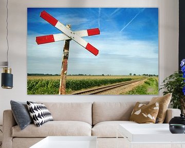 A railroad crossing with a single andreas cross by Marcel Mooij