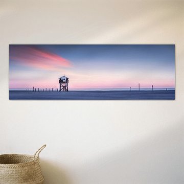 Pile dwellings on the beach in Sankt Peter Ording on the North Sea.
