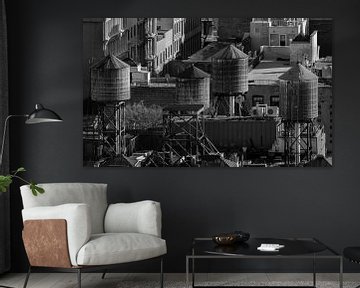 Water towers on the rooftops of New York City by Davey Bogaard