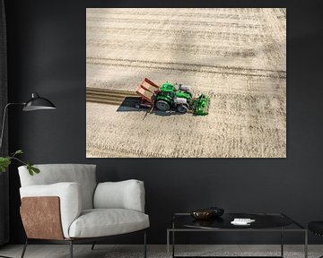 Tractor planting potato seeldings in  the soil during springtime by Sjoerd van der Wal Photography