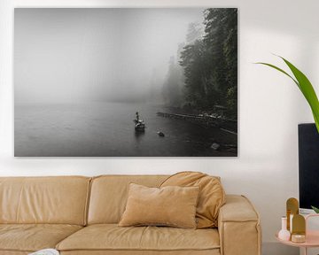 Landscape photo of a foggy misty lake with a statue of a mermaid by Jan Hermsen
